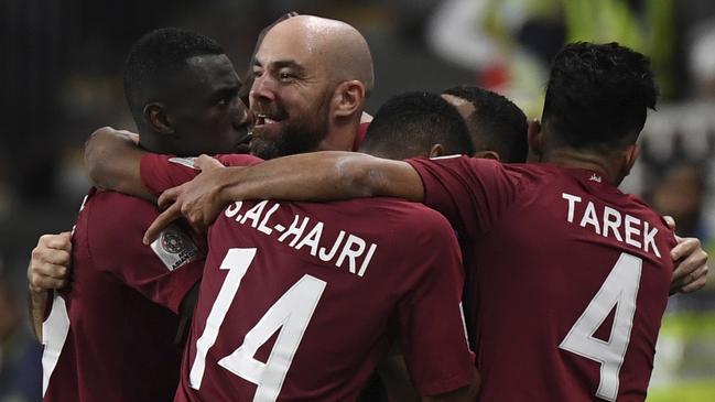 Qatar coach Felix Sanchez celebrates the Asian Cup semi-final win with his players