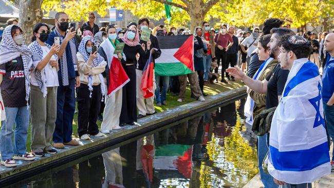 Jewish Israel supporters gather in a park near Melbourne University then walk into the university and face off with pro-Palestine protesters. Picture: Jason Edwards