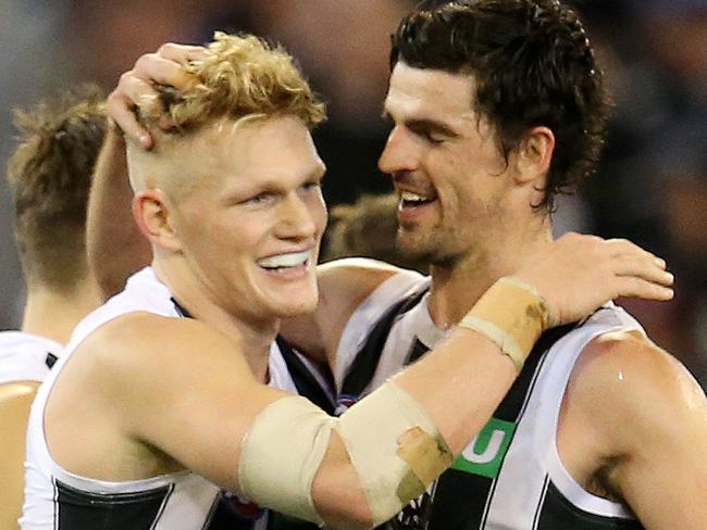 AFL Round 12. 11/06/2011. Melbourne v Collingwood at the MCG.  Collingwood's Adam Treloar celebrates his goal in the fourth quarter with Scott Pendlebury     . Pic: Michael Klein