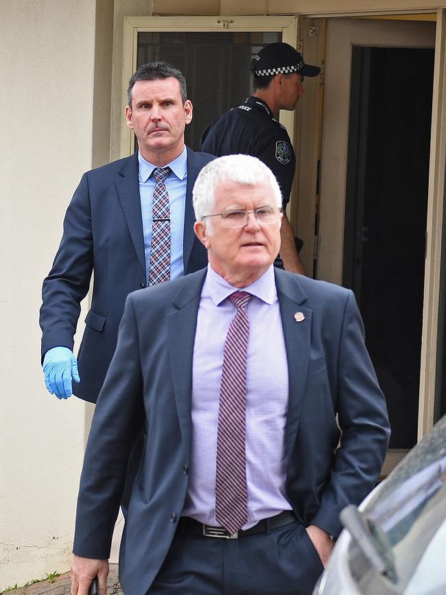 Major Crime officer-in-charge Detective Superintendent Des Bray and Detective Senior Sergeant Phil Neagle seize evidence from Integrity Care at Edwardstown in September last year. Picture: Tom Huntley