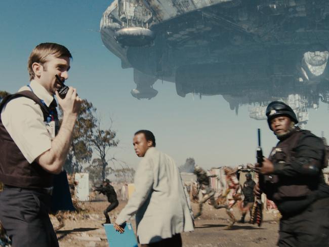 Sharlto Copley, Mandla Gaduka and Kenneth Nkosi in Neill Blomkamp’s <i>District 9</i>.