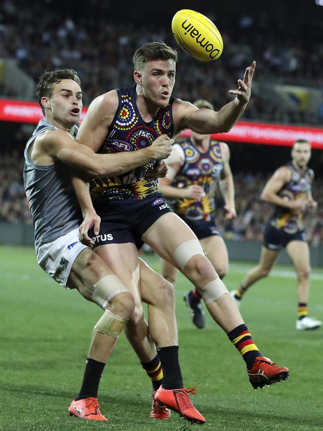 Karl Amon tackles Paul Seedsman during Port’s 57-point Showdown victory. Picture: Sarah Reed