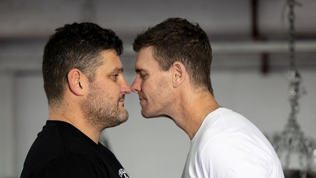 Cameron Mooney and Brendan Fevola face off ahead of the fight. Picture: Fiona Hamilton