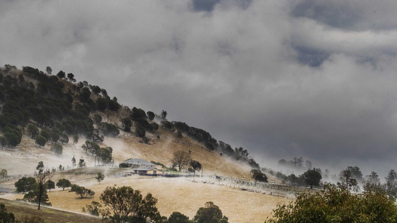 Properties at Long Flat south of Gympie resemble snowfields after a super cell dumped hail, tore down trees and caused devastation across the Burnett and South East. Photo Lachie Millard