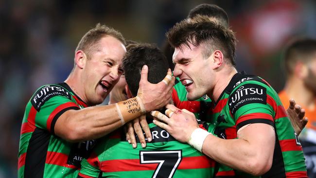 Adam Reynolds celebrates scoring a try with Jason Clark and Angus Crichton. Picture: Getty Images