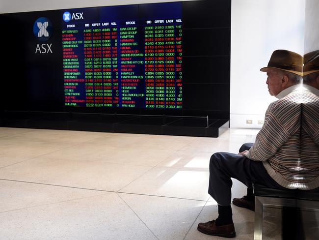 A man looks at stock prices displayed on an information screen at the Australian Securities Exchange (ASX) in Sydney, Monday, Sept. 12, 2016. The benchmark S&P/ASX 200 index was down 1.8 per cent at 1017 AEST, with all 12 indexes trading in red following a big sell-off on Wall Street.(AAP Image/Paul Miller) NO ARCHIVING