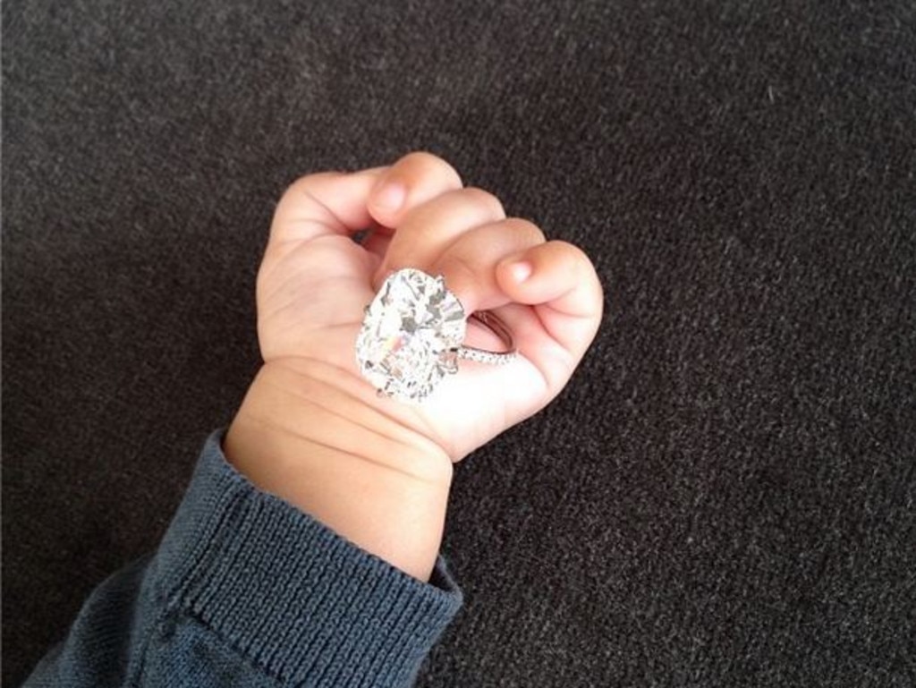 And her then baby girl, North, holding the ring. Picture: Instagram/kimkardashian