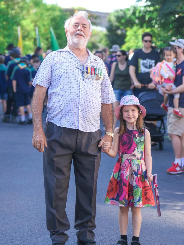 6 RAR Vietnam Veteran Kevin Cummins and granddaughter Maddie 6 at the march on Darwin's Knuckey St commemorating ANZAC Day 2021. Picture Glenn Campbell