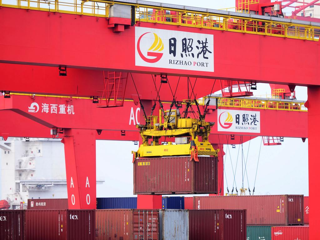 A bridge crane lifts a container on a quay at the Rizhao Port in Rizhao, Shandong Province of China. Picture: Yu Fangping/Visual China Group via Getty Images