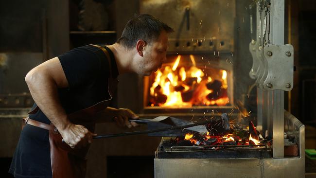 Lennox cooks with wood fire. Picture: John Appleyard