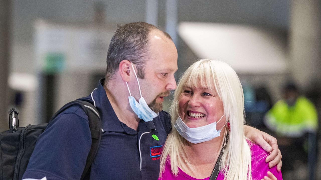 Jacky Dannie reunites with her husband Steve, who returned from Sydney to home quarantine. Picture: Nigel Hallett