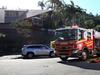 Man trapped as tractor rolls on suburban Cairns road