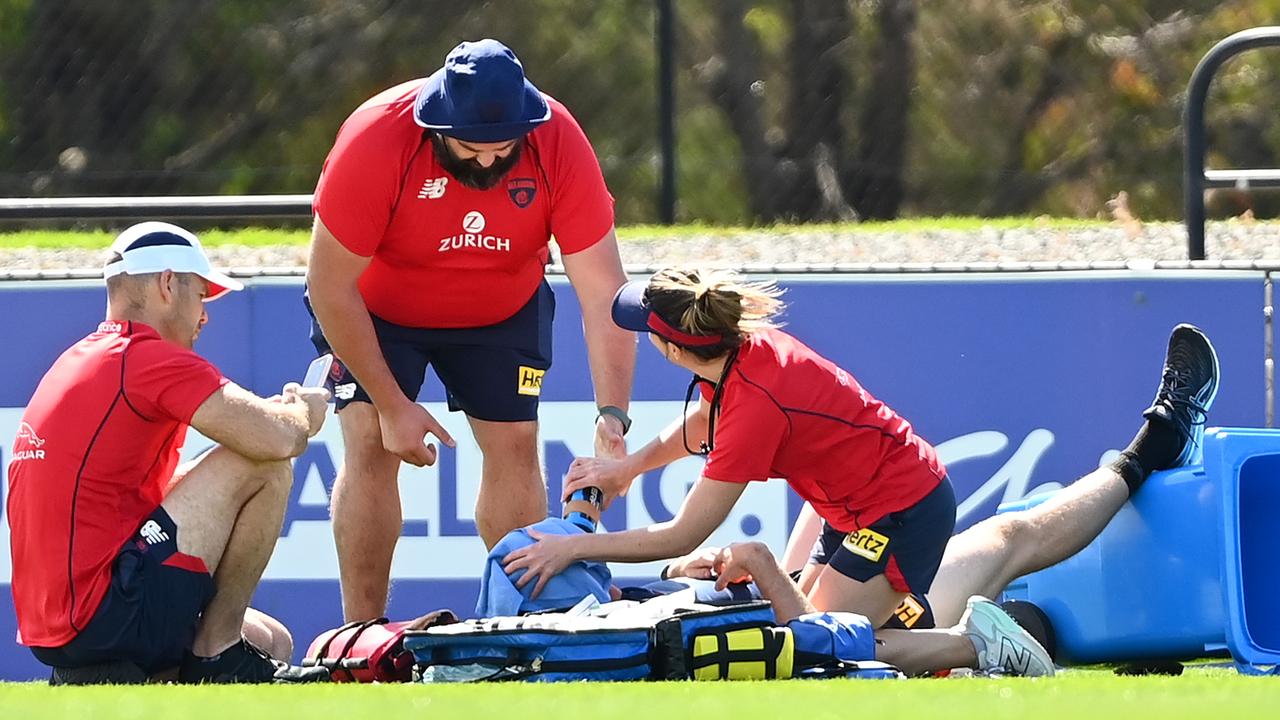 Medical staff attend to Jake Lever. (Photo by Quinn Rooney/Getty Images)