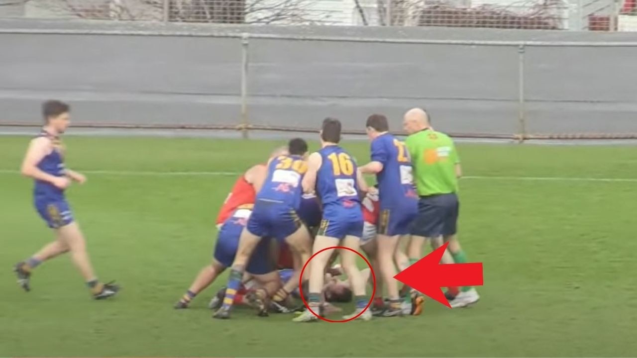 Players in a skirmish during the St Virgil's V OHA Old Scholars Grand Final after star player Jaye Bowden was left concussed (seen lying on the ground). Picture: DUFFTV