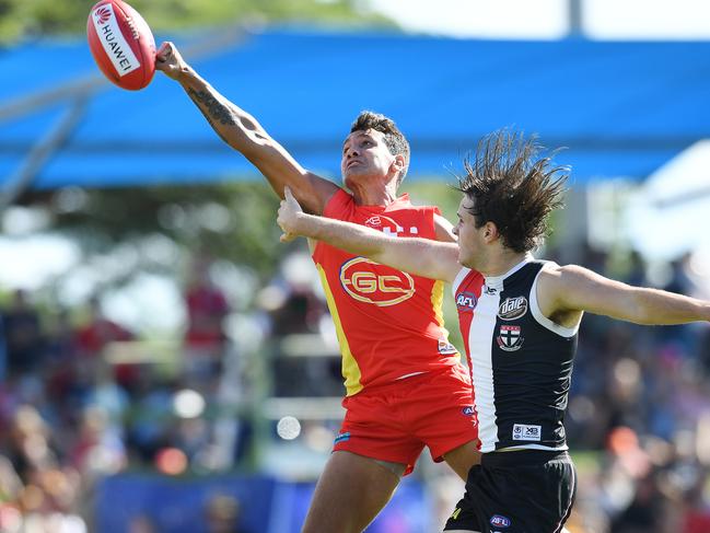 Callum Ah Chee of the Suns (left) and Hunter Clark of the Saints compete for the ball during the Round 13 AFL match between the Gold Coast Suns and the St Kilda Saints at Riverway Stadium in Townsville, Saturday, June 15, 2019. (AAP Image/Dan Peled)