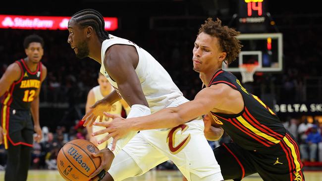 Dyson Daniels (right) is leading the league in steals and deflections. (Photo by Kevin C Cox/Getty Images via AFP)