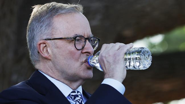 Labor Leader Anthony Albanese rehydrates during a press conference at Bentley Hospital, in the West Australian electorate of Swan. Picture: Getty Images