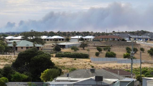 Residents in the Irwin, Mount Adams, Mount Horner and Yardarino in WA's Mid West have been told to leave now as fires burn on the edge of the town of Dongara. Here, smoke can be seen billowing from a home in Dongara on Saturday. Picture: Supplied