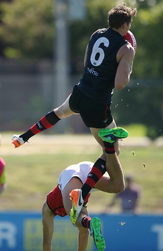 Joe Daniher takes a big grab over Kyle Langford. Picture: Wayne Ludbey