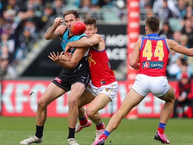 Josh Dunkley wraps up Jeremy Finlayson. Picture: Sarah Reed/AFL Photos via Getty Images