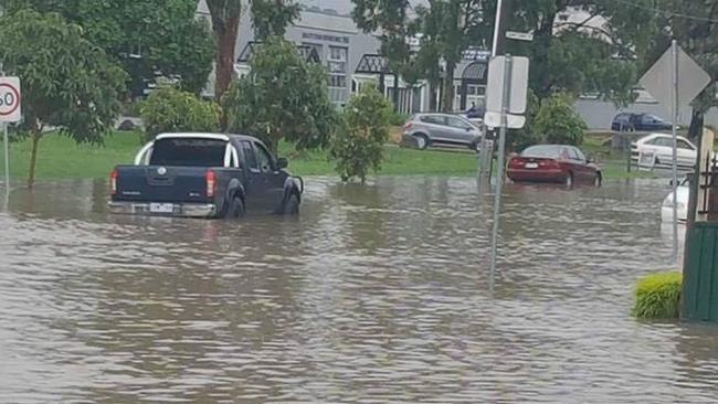 Cars struggled to get through the flooded Cave Hill Rd, Lilydale.