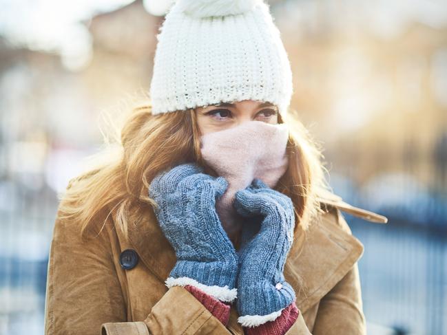 Shot of an attractive young woman enjoying being out in the snow