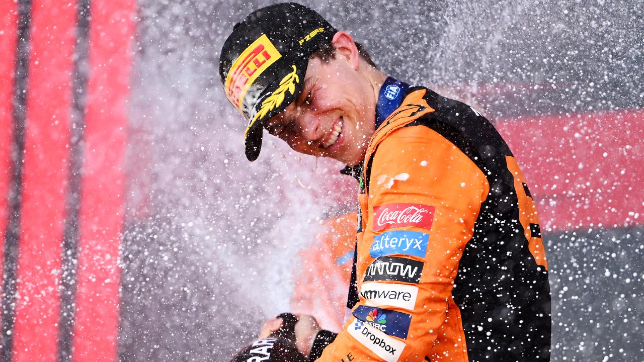 Race winner Oscar Piastri of Australia and McLaren celebrates on the podium during the F1 Grand Prix of Azerbaijan at Baku City Circuit on September 15, 2024 in Baku, Azerbaijan. (Photo by Dan Mullan/Getty Images)