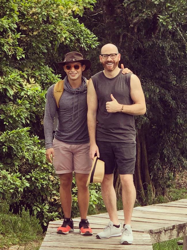 (L-R) Carlos Cardenas and husband Christopher Hassett who is taking legal action against Qantas over $10,000 in additional flights following a 12-day delay to his return service.