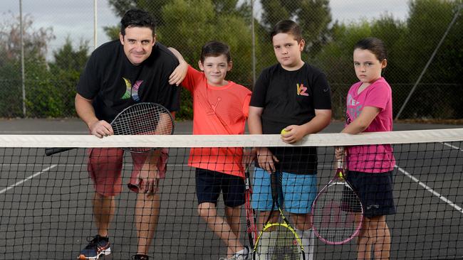 Travis Smith with his children Maeve, 8, and Angus, 8, and neighbour Patrick, 12. Picture: Naomi Jellicoe