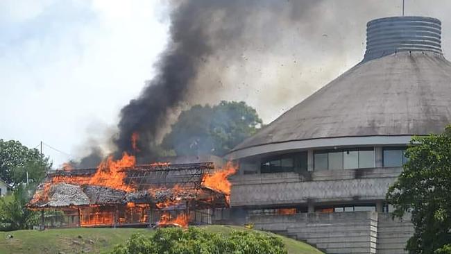 A buildign next to the Solomon Islands parliament on fire during the recent tensions in the region. Picture: Charley Piringi / AFP