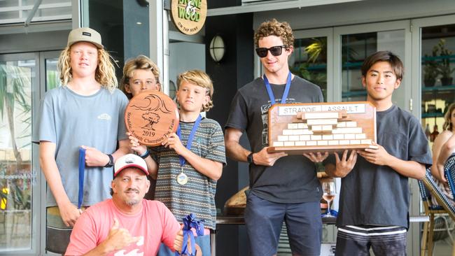 Burleigh Boardriders team of Tom Whitby, Harry Martin, Rico Haybittle and Liam O’Brien hold the winning Straddie Team Assault trophy with Sein Fujimoi and coach Kyle Robinson (front). Picture: Fiona Pyke/Straddie Surf pics.