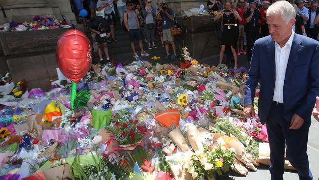 Prime Minister Malcolm Turnbull laid flowers at the public memorial site. Picture: David Crosling