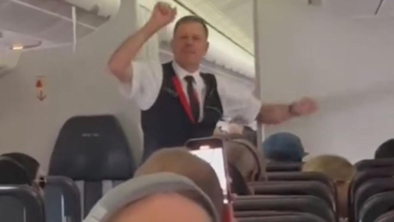 An enthusiastic Qantas crew man has encouraged travelling Swifties to get into the celebrations a little early by joining in on a singsong on a flight to Melbourne. Picture: TikTok