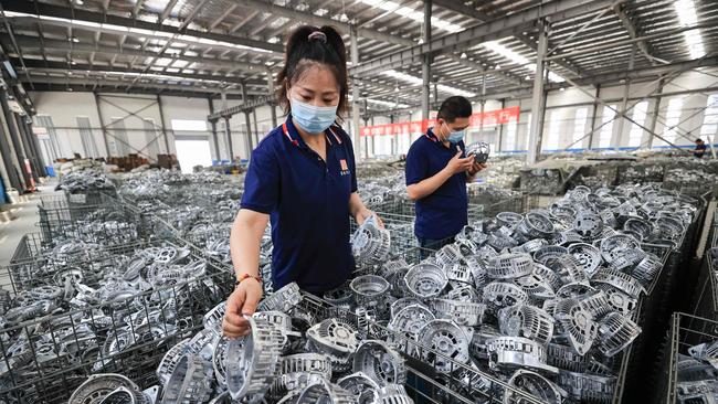 In just two decades China has become the factory of the world. Employees work at a factory that produces car parts for export in Lianyungang. Picture: AFP