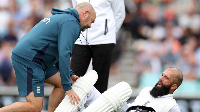 Ali is tended to by an English physio on day one. (Photo by Ryan Pierse/Getty Images)