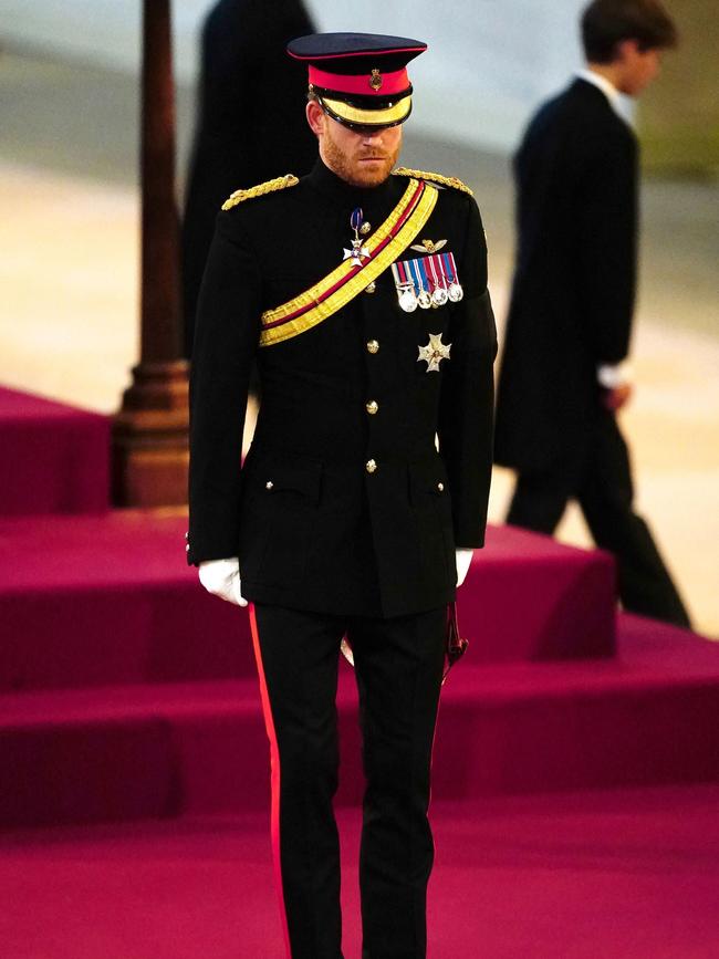 Prince Harry, Duke of Sussex, holds a vigil around the coffin of Queen Elizabeth II.