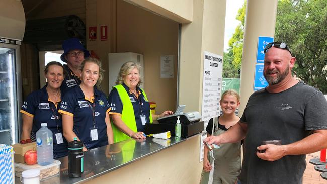 Marist Brothers Ram Lismore canteen supremo Karen Flanagan (far left) said fans snapped up steak and chicken burgers, hot dogs, fries and over hundreds of pies and cold drinks when the Gold Coast Titans play the New Zealand Warriors at Oakes Oval on February 27, 2021. Photo: Alison Paterson