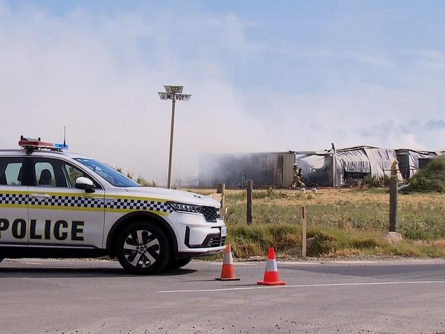 Police and fire crews attend a shed fire at Waterloo Corner. Picture: 7NEWS