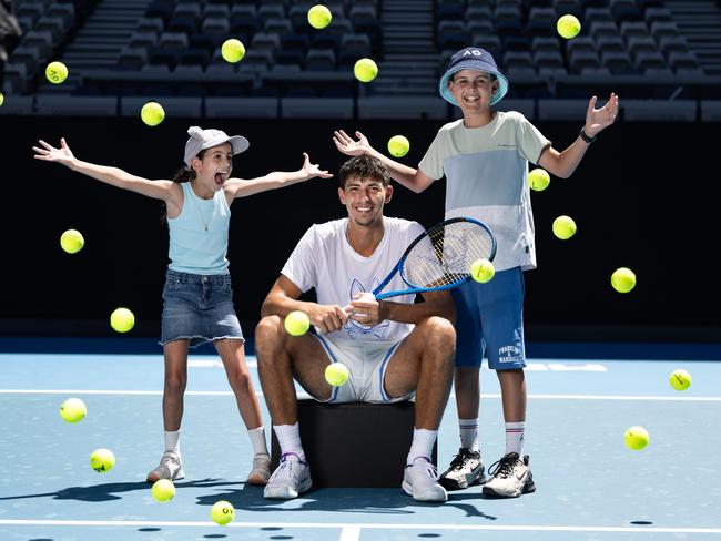 Alexei Popyrin meets young fans Ella and Sam ahead of AO 2025 Opening Week. Picture: Tennis Australia