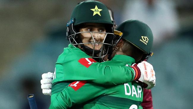 CANBERRA, AUSTRALIA - FEBRUARY 26: Nida Dar of Pakistan and Bismah Maroof of Pakistan celebrate winning the ICC Women's T20 Cricket World Cup match between the West Indies and Pakistan at Manuka Oval on February 26, 2020 in Canberra, Australia. (Photo by Cameron Spencer/Getty Images)