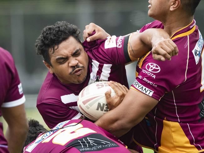 Yarrabah’s Keison Hunter-Flanders is hit in a strong tackle. Picture: Brian Cassey