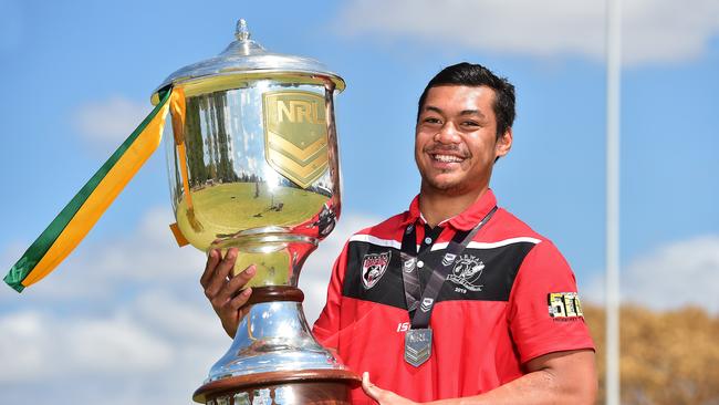 Kirwan star Jeremia Nanai holds the NRL Schoolboys Cup after his team won the national final. Picture: Shae Beplate