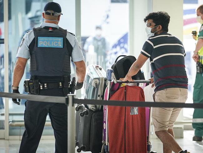 International Mercy Flight into Adelaide with passenger getting escorted to quarantine into  Pullman's Hotel in Hindmarsh Square, AFP, ABF, SAPOL, SAH all in attendence to escort passengers Monday April 20, 2020 - pic MIKE BURTON/AAP