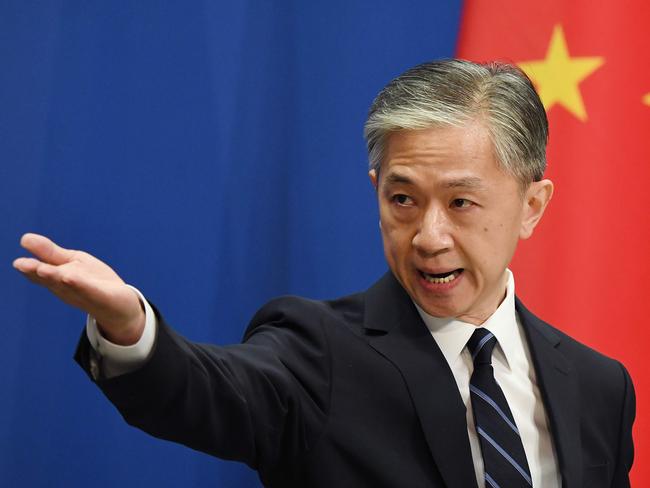 Chinese Foreign Ministry spokesman Wang Wenbin takes a question during the daily Foreign Ministry briefing in Beijing on July 24, 2020. - China on July 24 ordered the US consulate in the southwestern city of Chengdu to close in retaliation for one of its missions in the United States being shuttered, capping a furious week of Cold War-style diplomacy. (Photo by GREG BAKER / AFP)