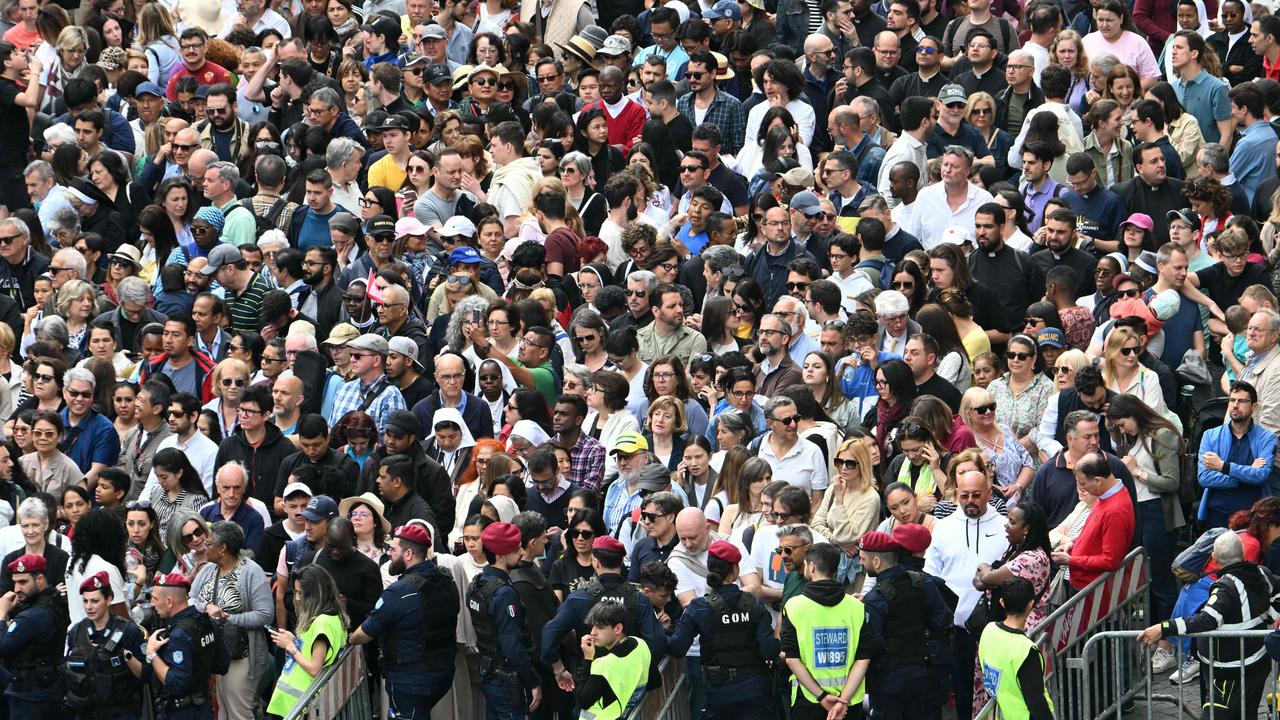 People queue at security checks to enter St Peter's square ahead of Pope Leo’s Regina Caeli prayer. Picture: Stefano Rellandini / AFP