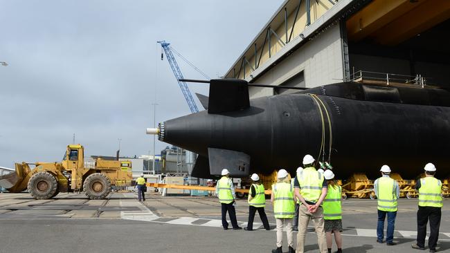 Collins class submarine HMAS Farncomb being rolled out from maintenance shed at ASC ... the Defence White Paper has committed to 12 submarines, nine future frigates and 12 offshore patrol vessels.