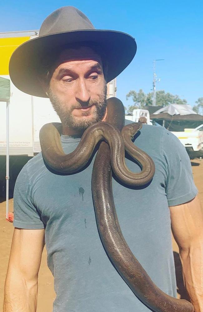 Host Jonathan LaPaglia with a wild snake caught on the set of Australian Survivor. Picure: Supplied