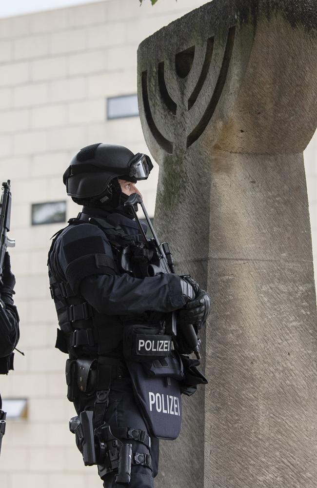 Police secure a synagogue in Halle, Germany, after a gunman opened fire, killing two people. Picture: AP