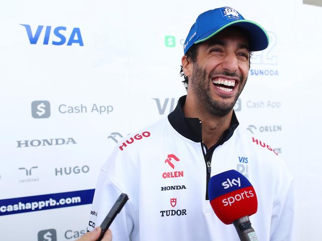 SUZUKA, JAPAN - APRIL 04: Daniel Ricciardo of Australia and Visa Cash App RB talks to the media in the Paddock during previews ahead of the F1 Grand Prix of Japan at Suzuka International Racing Course on April 04, 2024 in Suzuka, Japan. (Photo by Peter Fox/Getty Images)