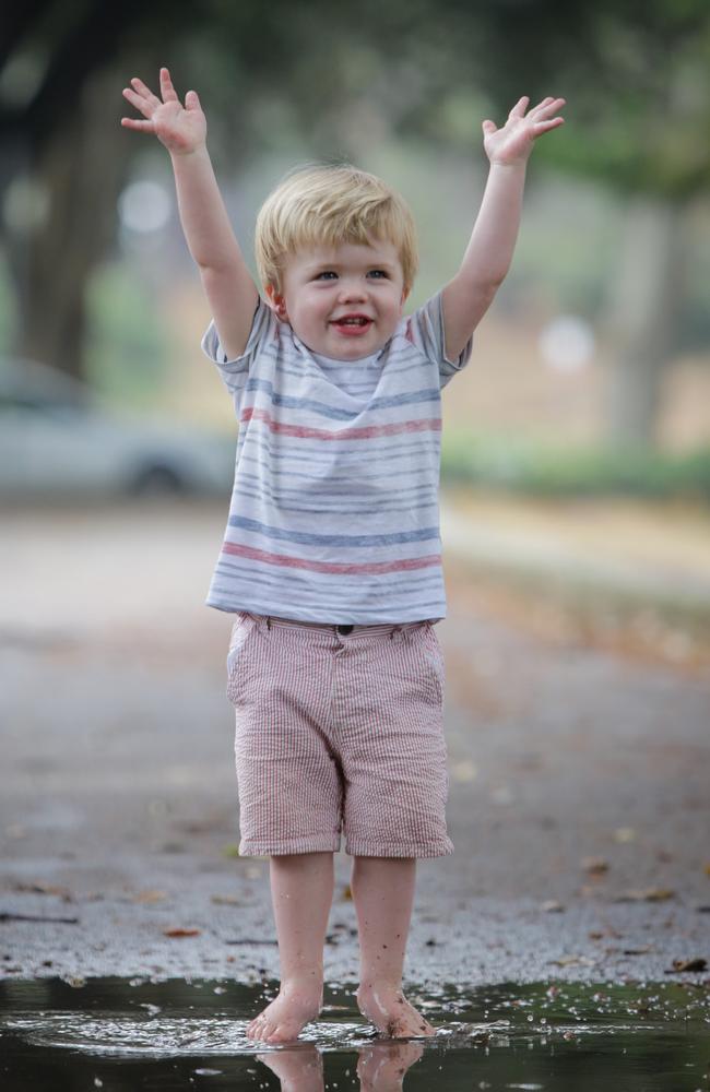 Rafferty Eddington, 1, of Paddington jumps in a puddle at Centennial Park. Picture: Liam Driver